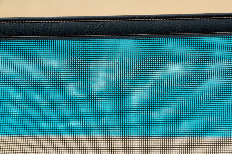 Mesh Fence with Pool in Background